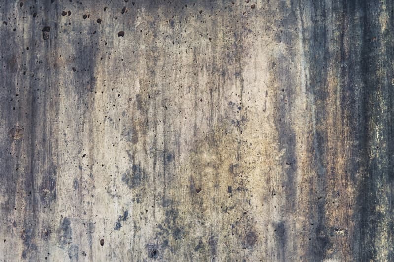 Worn concrete surface before repairs and coating